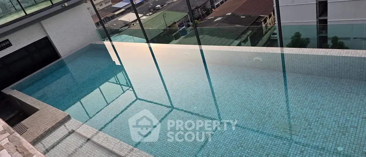 Luxurious rooftop infinity pool with stunning city views, perfect for relaxation and leisure in a modern urban setting.