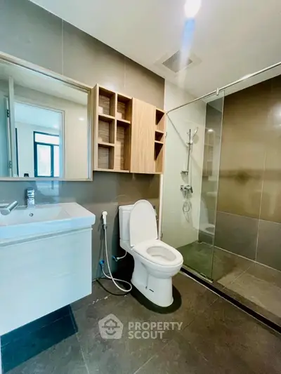 Modern bathroom with glass shower and sleek fixtures
