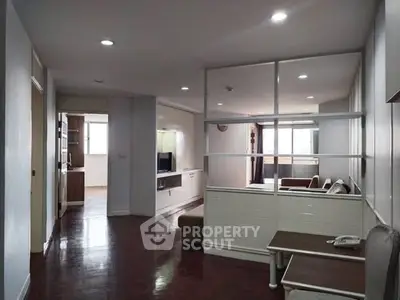 Spacious open-plan living area with modern decor and natural light.