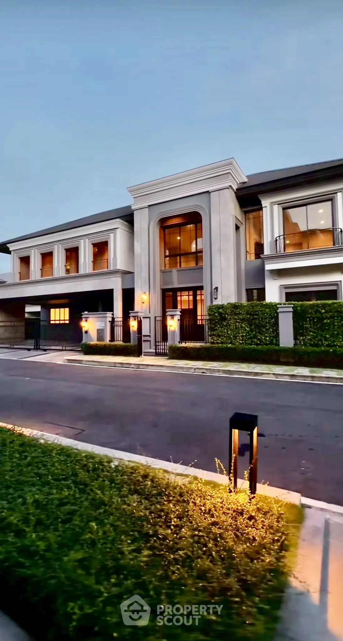 Luxurious modern mansion with elegant facade and lush landscaping