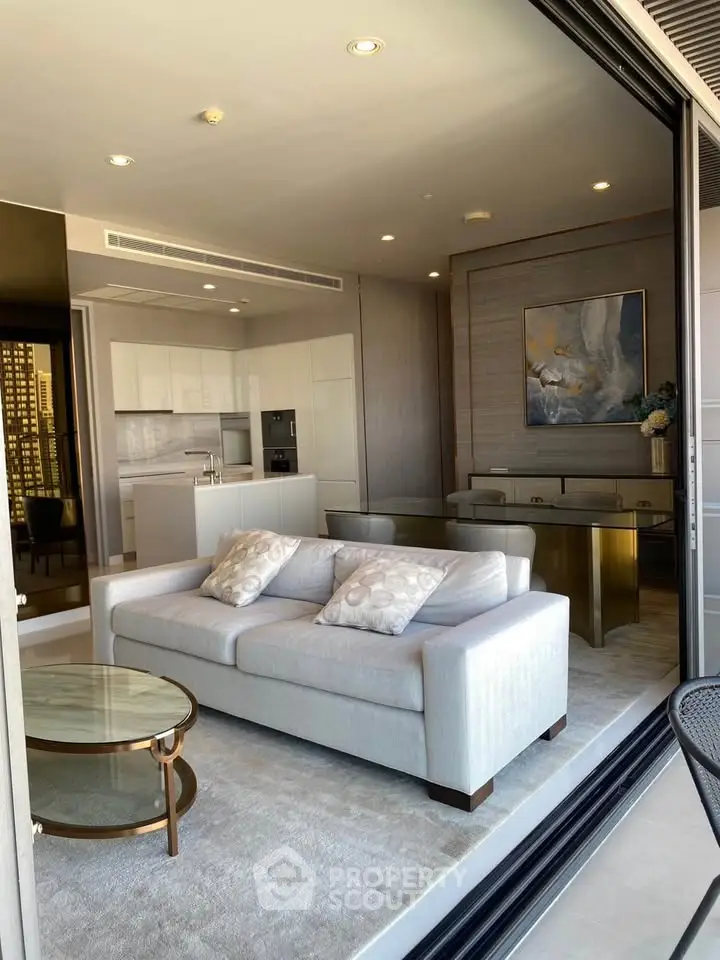 Luxurious open-plan living room with modern kitchen and elegant decor