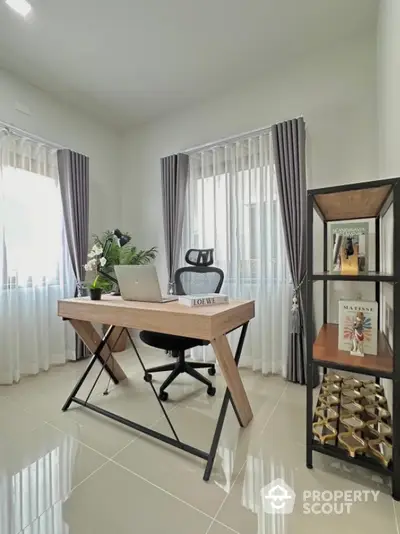 Modern home office with stylish desk and ergonomic chair, perfect for productivity.