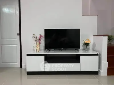 Modern living room with sleek TV stand and minimalist decor