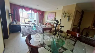 Spacious living room with elegant decor and balcony view in a modern apartment.