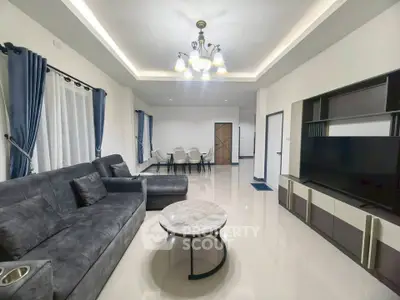 Spacious modern living room with elegant decor and ample natural light