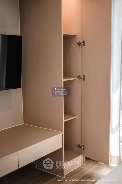 Modern living room with built-in storage and sleek TV setup