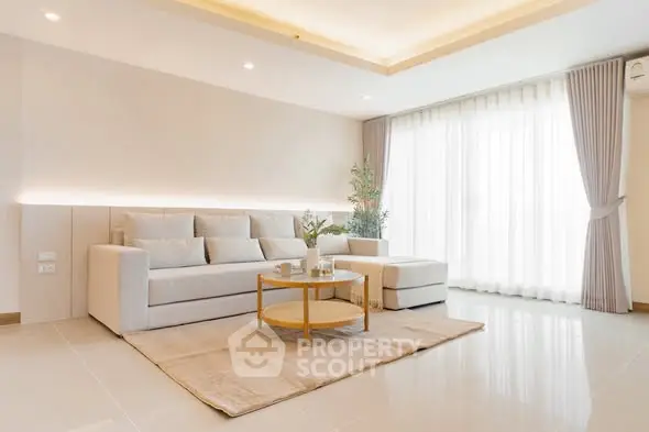 Elegant living room with modern decor and natural light