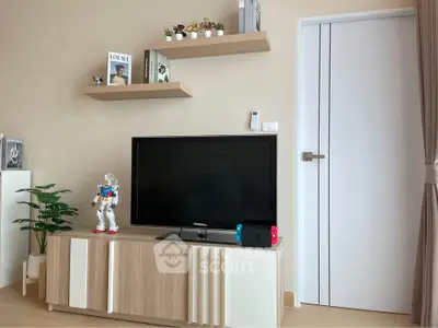 Modern living room with sleek TV stand, stylish shelves, and decorative plants.