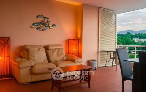 Spacious balcony with cozy seating and scenic view, perfect for relaxation and entertaining.