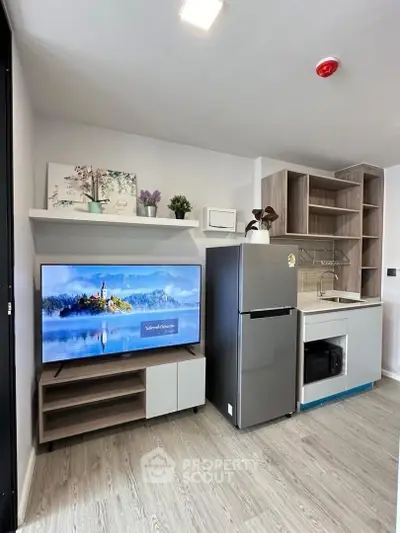 Modern kitchen with sleek appliances and stylish shelving in a compact layout.