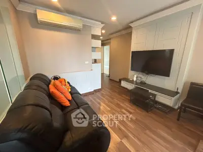 Modern living room with sleek design and cozy seating area