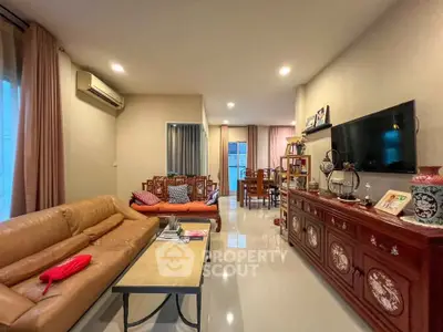 Spacious living room with elegant decor and modern amenities, perfect for family gatherings.