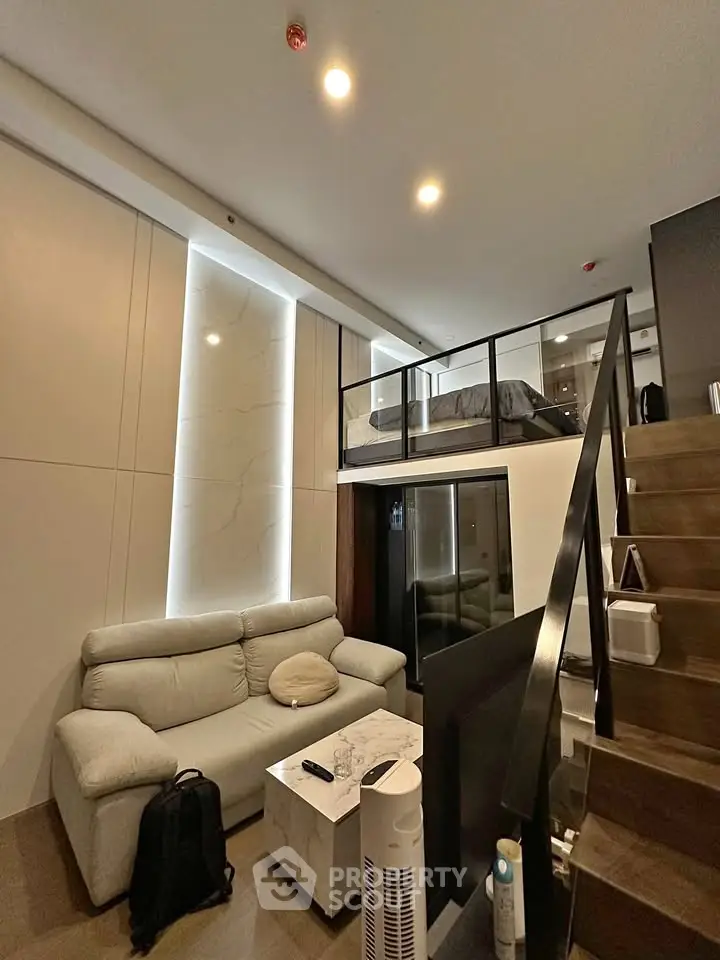 Modern loft apartment with stylish living area and mezzanine bedroom