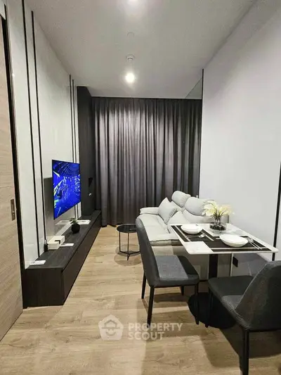 Modern living room with sleek furniture and dining area, perfect for urban living.