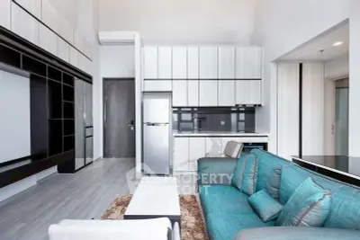 Modern open-concept living room with sleek kitchen and stylish furniture