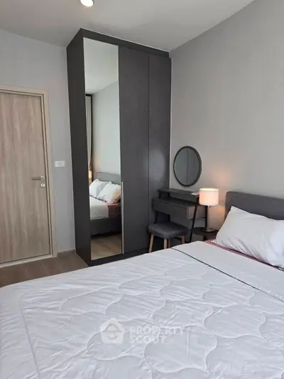 Modern bedroom with sleek furniture and cozy ambiance