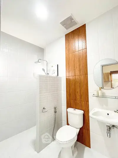 Modern bathroom with sleek design and wooden accent wall
