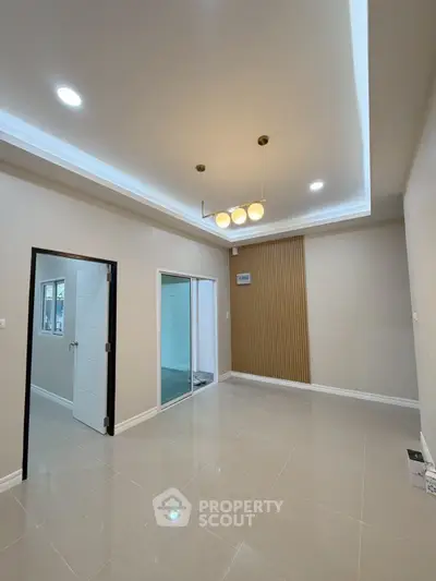 Modern interior with elegant lighting and sleek tile flooring, perfect for stylish living.