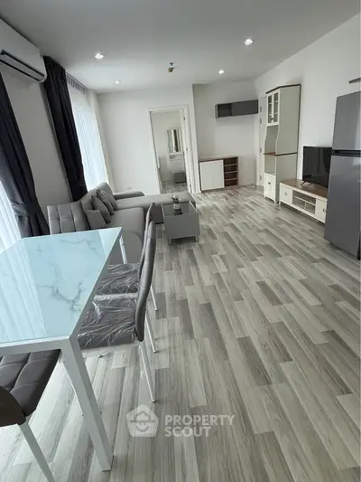 Spacious modern living room with stylish furniture and natural light