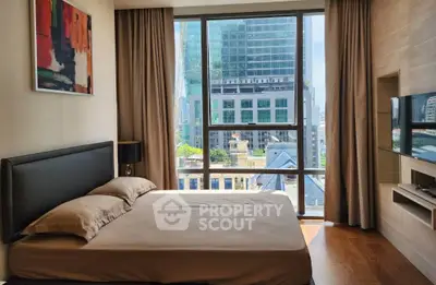 Modern bedroom with city view, large windows, and stylish decor in urban apartment.