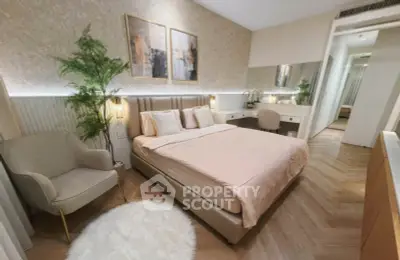 Luxurious bedroom with elegant decor and cozy ambiance, featuring a plush bed and stylish furnishings.