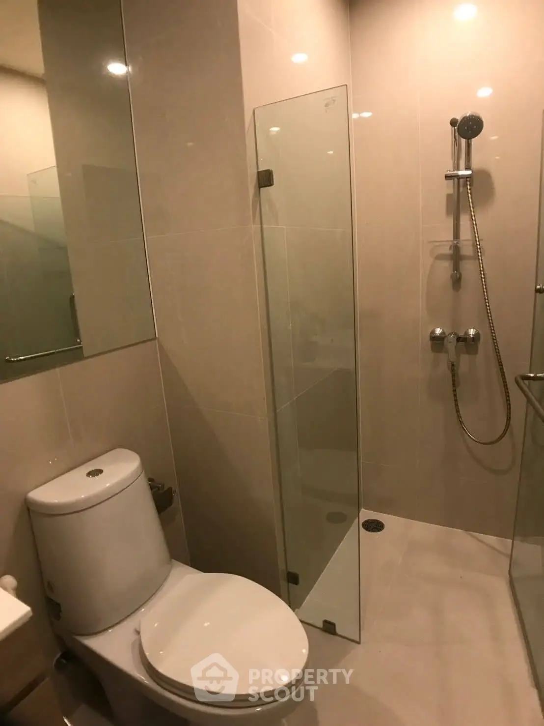 Modern bathroom with glass shower and sleek fixtures