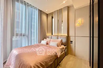 Luxurious bedroom with elegant decor and large windows in modern apartment