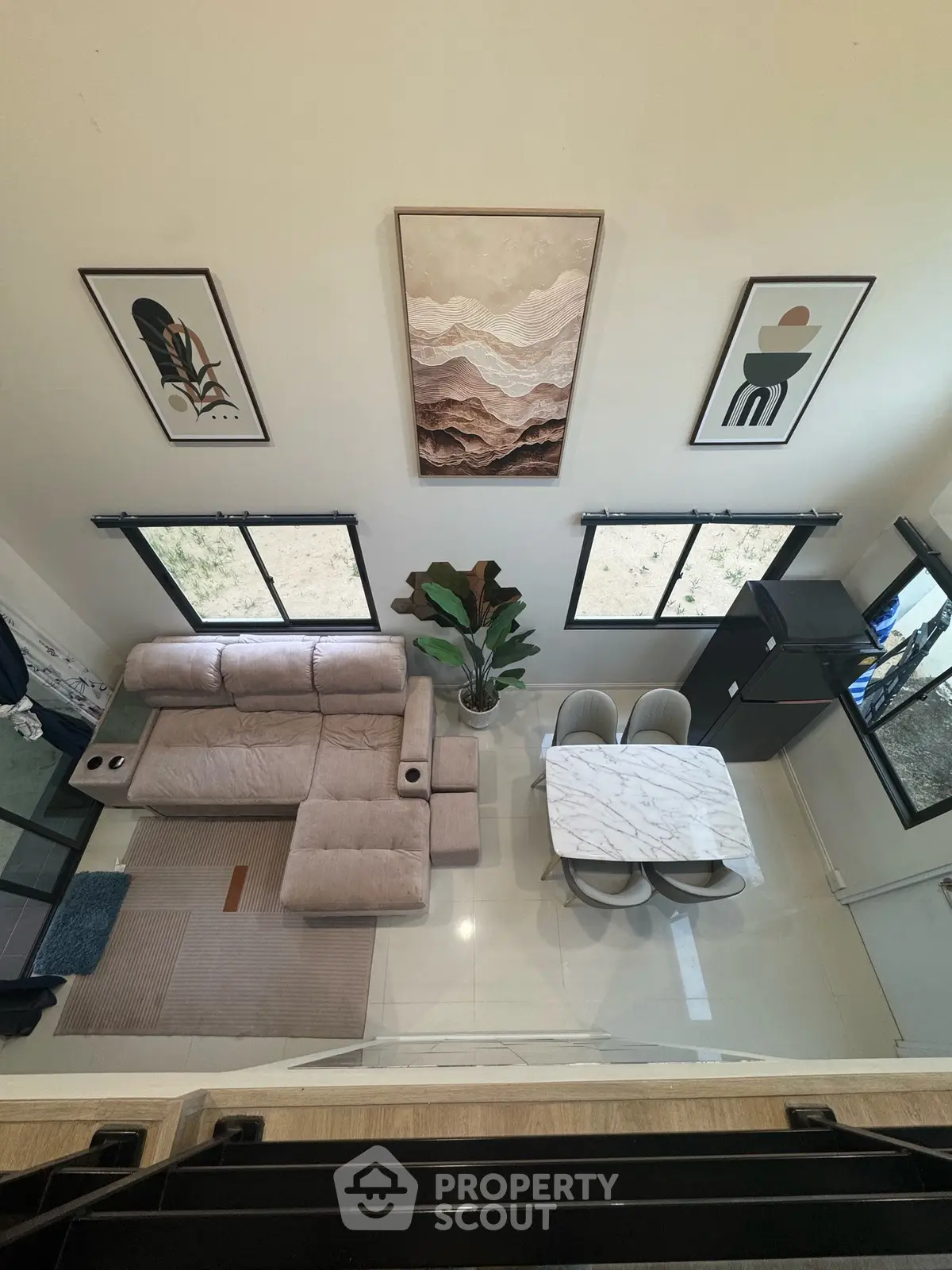 Modern living room with stylish decor, cozy seating, and elegant dining area in a contemporary home.