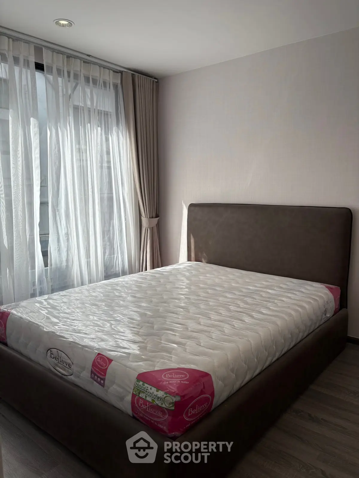 Cozy bedroom with modern bed and natural light