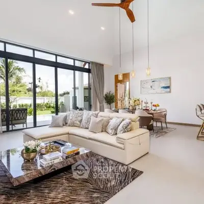 Luxurious open-plan living room with elegant decor and large windows overlooking a lush garden.