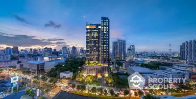 Stunning cityscape view of modern high-rise building at dusk with vibrant skyline