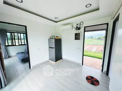 Modern interior with air conditioning and scenic view, featuring sleek flooring and minimalist design.