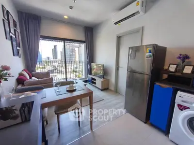 Modern living room with city view, featuring stylish furniture and appliances.