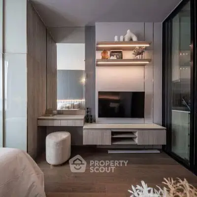 Modern bedroom with sleek TV setup and stylish decor