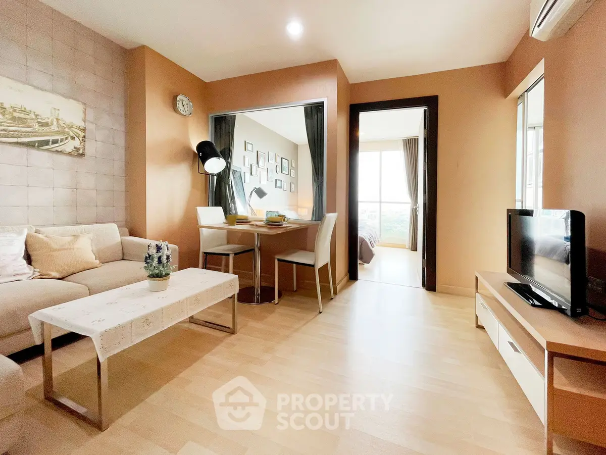 Modern living room with cozy dining area and stylish decor in a bright apartment.