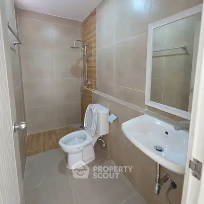 Modern bathroom with sleek fixtures and neutral tile design