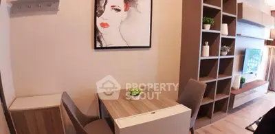Modern living room with stylish decor and functional furniture in a cozy apartment setting.