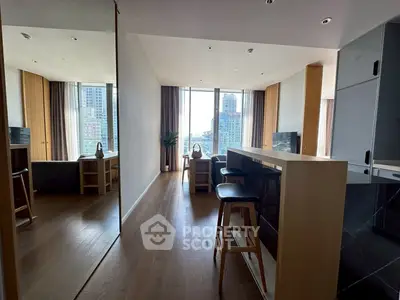 Modern open-plan living room with city view and stylish kitchen bar