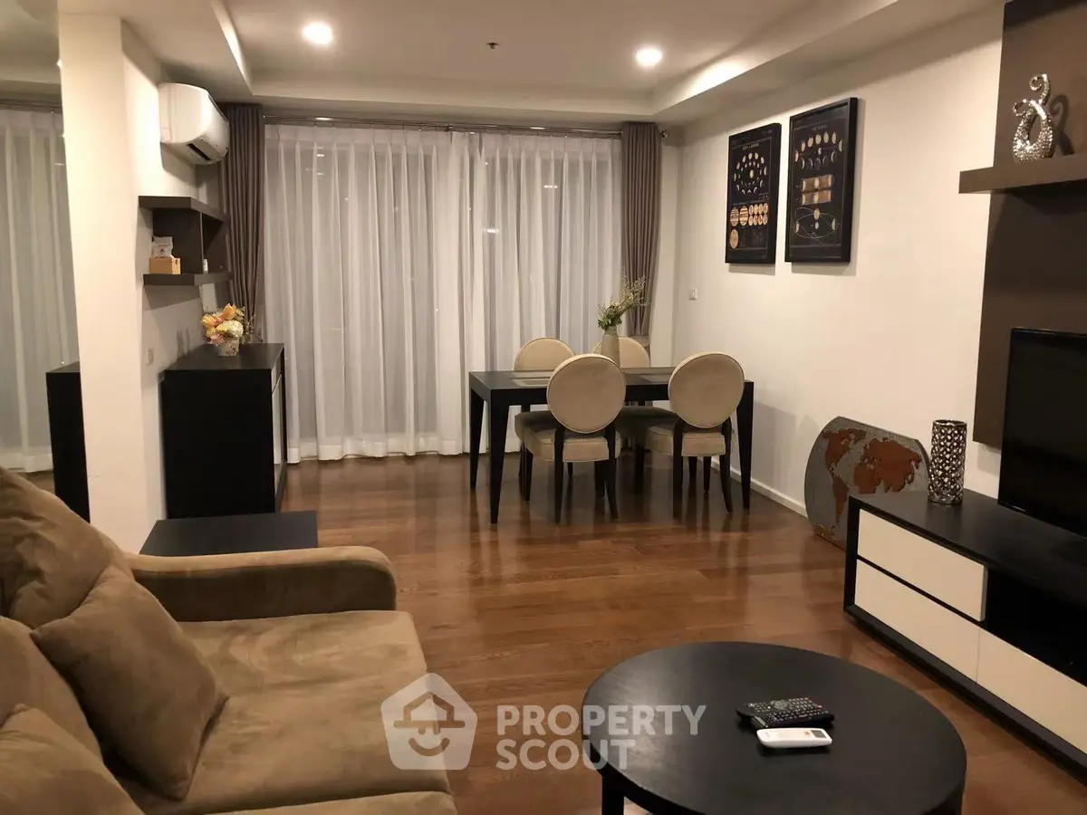 Spacious living room with elegant dining area and modern decor