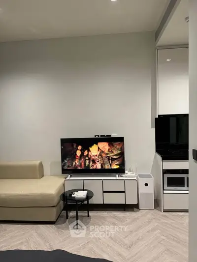 Modern living room with sleek TV setup and stylish furniture