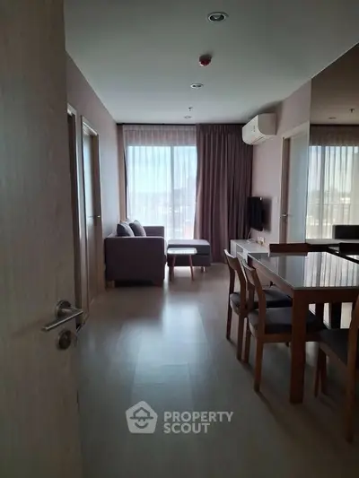 Spacious living room with modern furniture and natural light