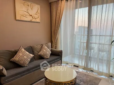 Elegant living room with cozy sofa and balcony view