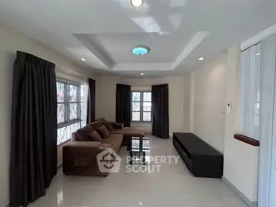 Spacious living room with modern sofa and natural light