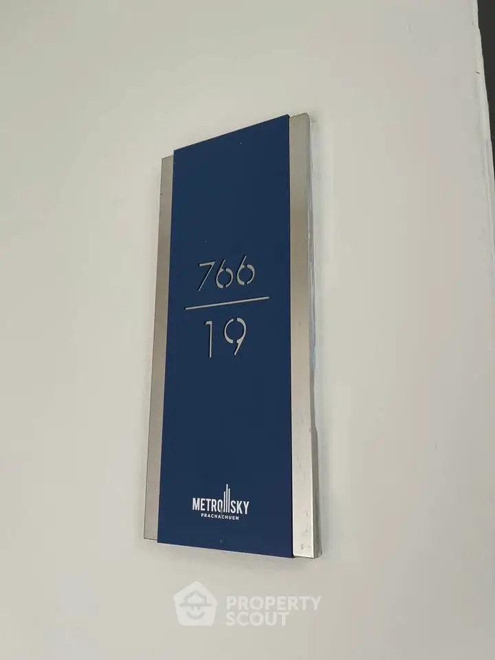 Modern apartment number sign with sleek design at Metro Sky Pracachuen.