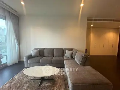 Spacious modern living room with cozy sectional sofa and elegant decor