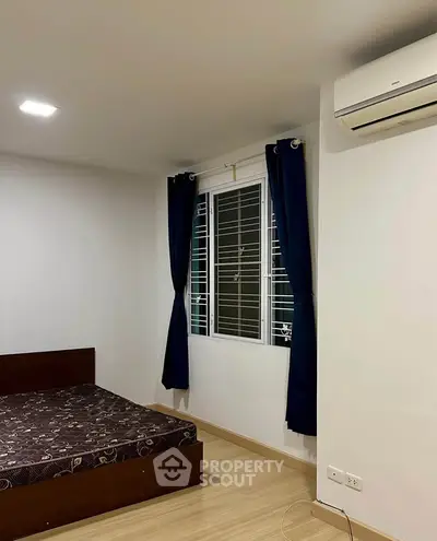 Cozy bedroom with modern air conditioning and stylish dark curtains