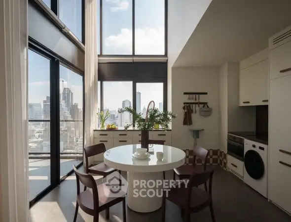 Stunning modern kitchen with panoramic city views and sleek design.