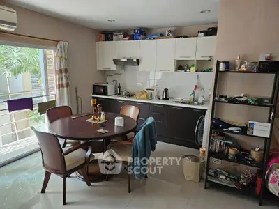 Cozy kitchen with dining area and modern appliances in a bright open layout.