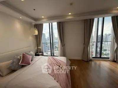 Luxurious bedroom with city view and elegant decor in modern apartment