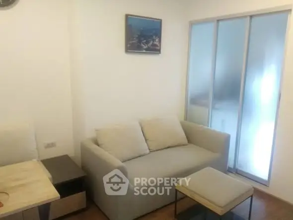 Cozy living room with modern sofa and sliding glass doors